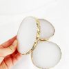 White agate look resin coasters with a gold foil edge